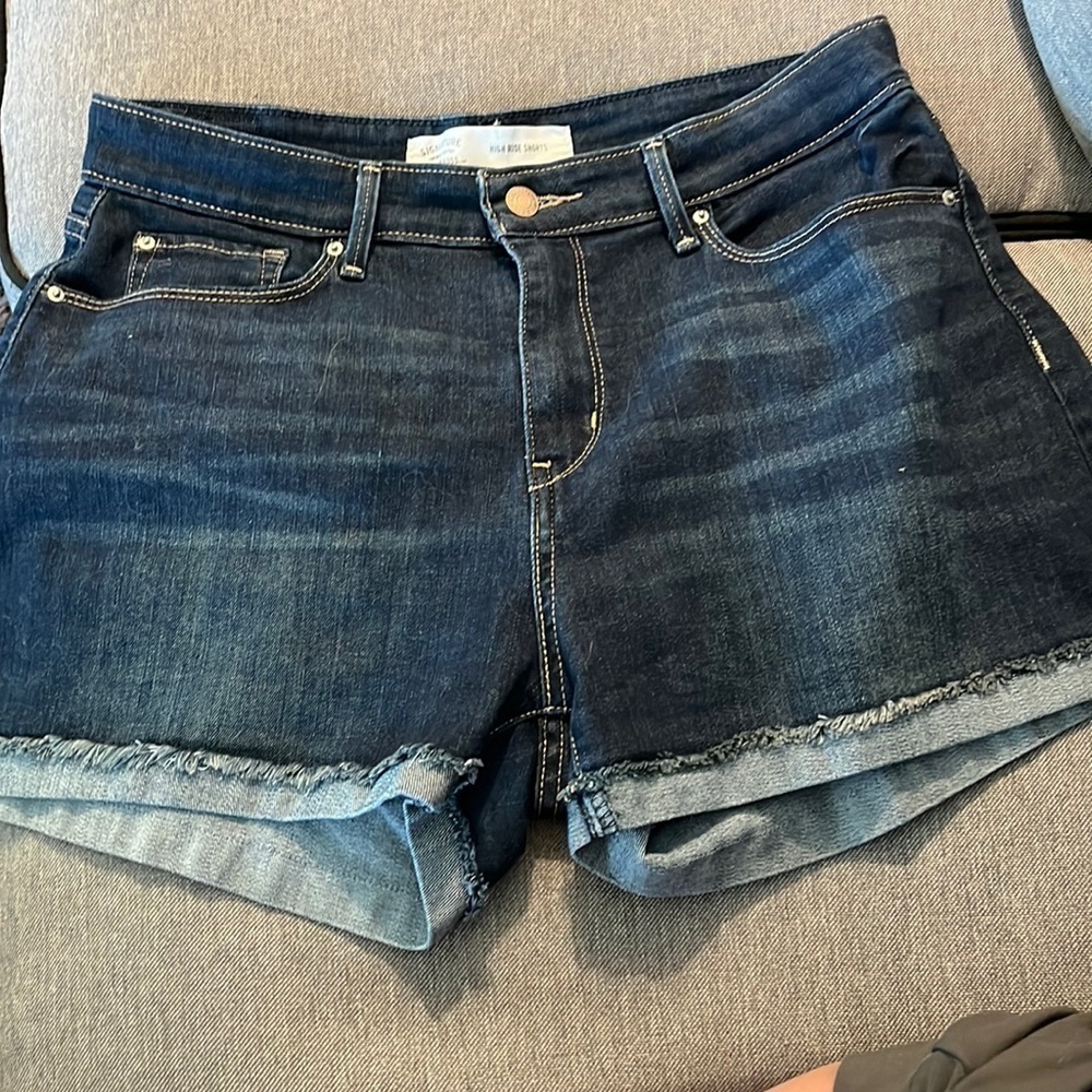 Levi’s high rise shorts size 10 waist is 30.  Has a slight cuff with fraying.